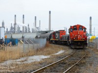 Here's an angle you can't do when it's sunny - well, not gracefully. A CN Remote control job is reversing down the Farm Track to work Imperial Oil and VIP's Sarnia yard - in the background is the sprawling Imperial Oil Refinery. Interesting to see a 4100 series GP9 in remote control service.