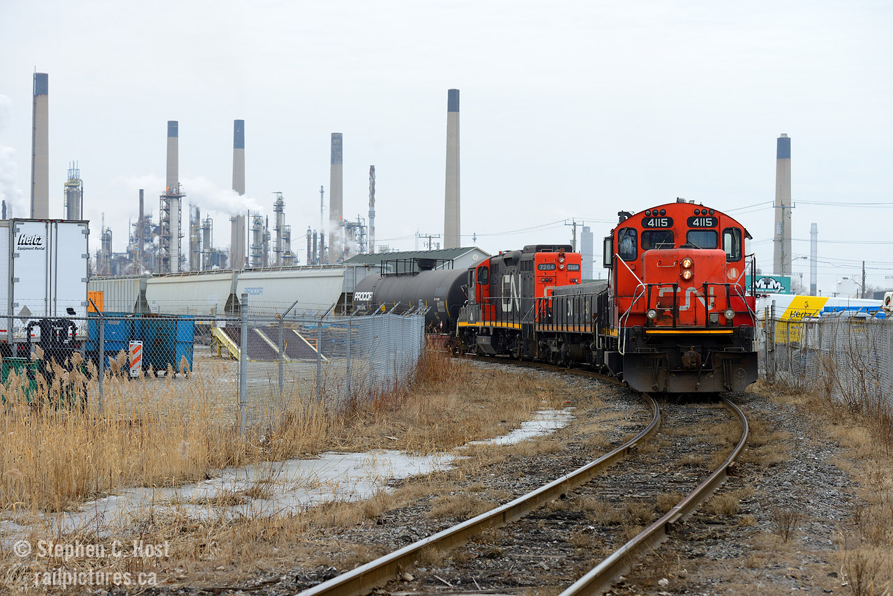 Here's an angle you can't do when it's sunny - well, not gracefully. A CN Remote control job is reversing down the Farm Track to work Imperial Oil and VIP's Sarnia yard - in the background is the sprawling Imperial Oil Refinery. Interesting to see a 4100 series GP9 in remote control service.