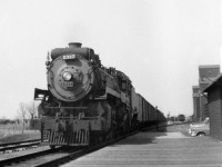 After walking train while G3c 4-6-2 2317 took on coal and water at the west end of town, the conductor gets off at the station to fill out the train register. In the steam era grain moving from southeast Saskatchewan moved from Weyburn via the Kisbey and Arcola subdivisions through a terminal at Souris. The 2317 is preserved at Steamtown in Scranton Penn.

