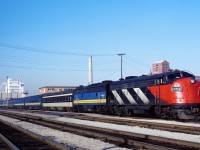 In the early days of VIA, we see VIA 6514 and helper 6616 preparing to depart Windsor with Toronto-bound train 74. At this time there were 5 trains daily each way while today there are 4 each way, although much shorter in size (usually 4 cars).