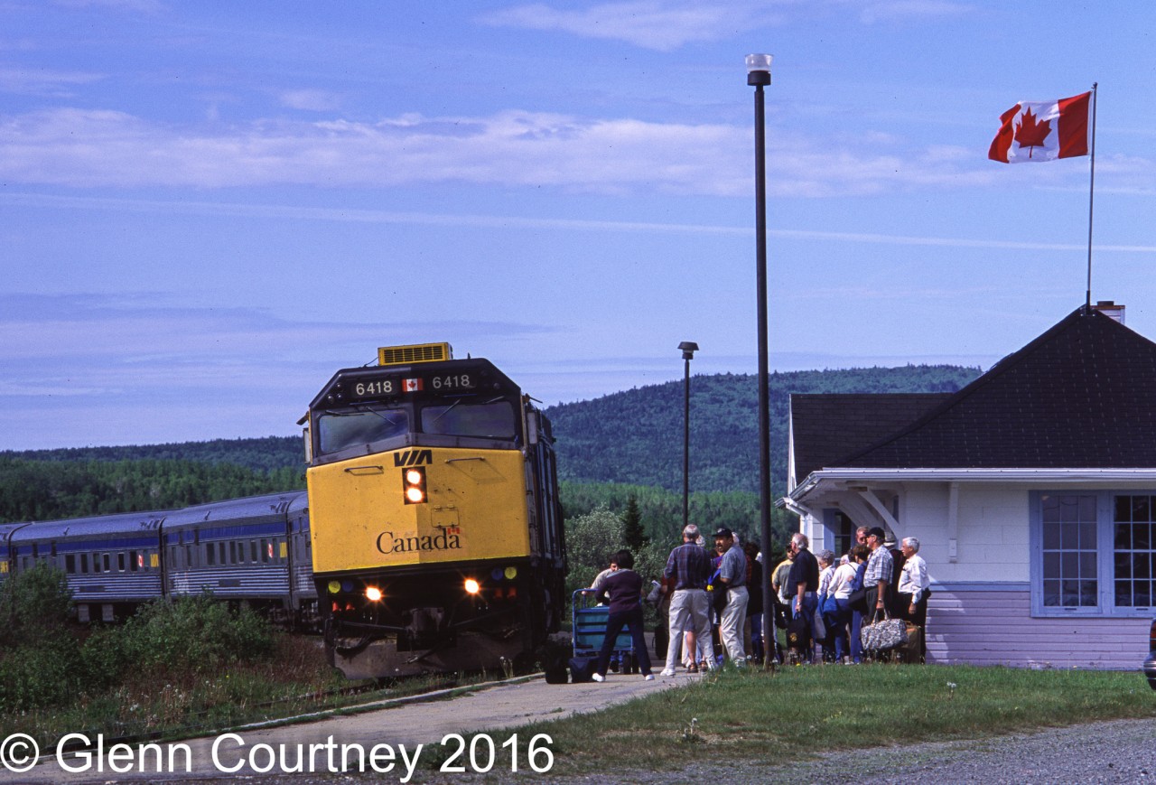 I only chased the Chaleur twice and both occasions were this week in 2001. I was in the area for 4 days with my Dad and we had gorgeous weather and enough trains to keep us occupied almost the entire time. The Chaleur is approaching its stop at Perce on the return from Gaspe to Matapedia. Perce station is not actually in Perce town as the rail line heads inland and across the peninsula before reaching Perce. 

This was a great chase but I still haven't forgotten about the beautiful pair of Serengetti sunglasses I lost here, somewhere in the tall grass!