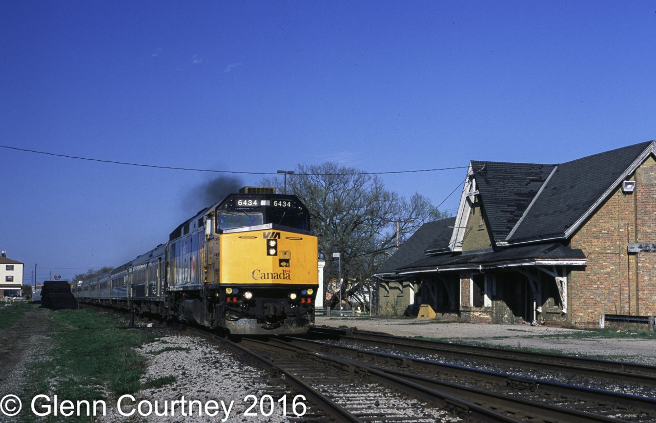 Surprisingly the CN station in Ingersoll doesn't appear too much worse off today than it appeared in 2002! The station is already abandoned and disused as #75 blows through town on the north track.