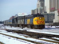 It was thirty-nine years ago this morning as I post this; Feb 26/78, also a Sunday; and at 10:50 on a not-all-that-bad morning, roughly 40F (3C?) the Rapido #62 is seen pulling out of the sheds at Union Station making its start to Montreal. It is transition time in the early years of VIA, thus we have a "CN" on the nose and a "VIA" on the sides of the lead 6762. Behind, still in traditional CN, are B unit 6862 and RS-18 #3113. The 11 cars in tow are of various paints, as the move to standardize the VIA yellow and gold was just under way. Note the old O'Keefe Centre on the right. No chance of shooting from this angle any more........