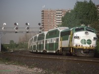 A Westbound GO Train negotiates the S-Curve just West of Scarborough Golf Club Rd on May 30th 1988 with APCU 900 on the rear.