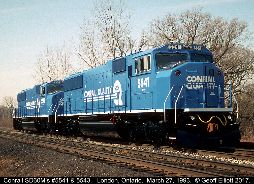 Conrail SD50M's #5541 and 5543 stretch their legs on the GMDD test track in London, Ontario back on March 27, 1993.  It was always a crap shoot heading to the test track, but it was a ritual if you were going to London for the day.  Now it's just a faint memory recorded on film.....  Sad.....