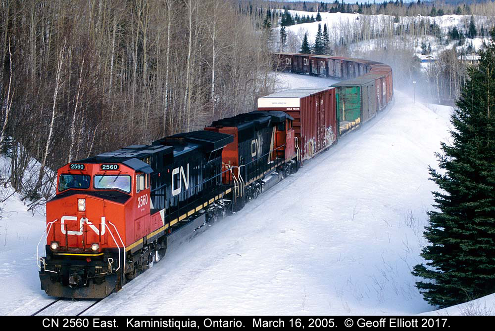 CN 2560 leads an eastbound around the curve near Kaministiquia, Ontario on CN's Kashabowie Subdivision on a cold March 16th back in 2005.  The train is about to pass under Highway 102 as it continues east toward Thunder Bay, Ontario.