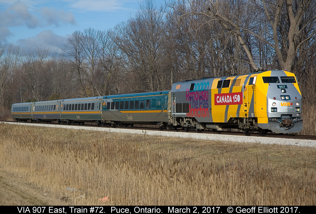 Having left Windsor 22 minutes previous, VIA train #72, with "Canada 150" wrap unit #907, speeds through Puce, Ontario on what certainly does not look like a March 2nd day.