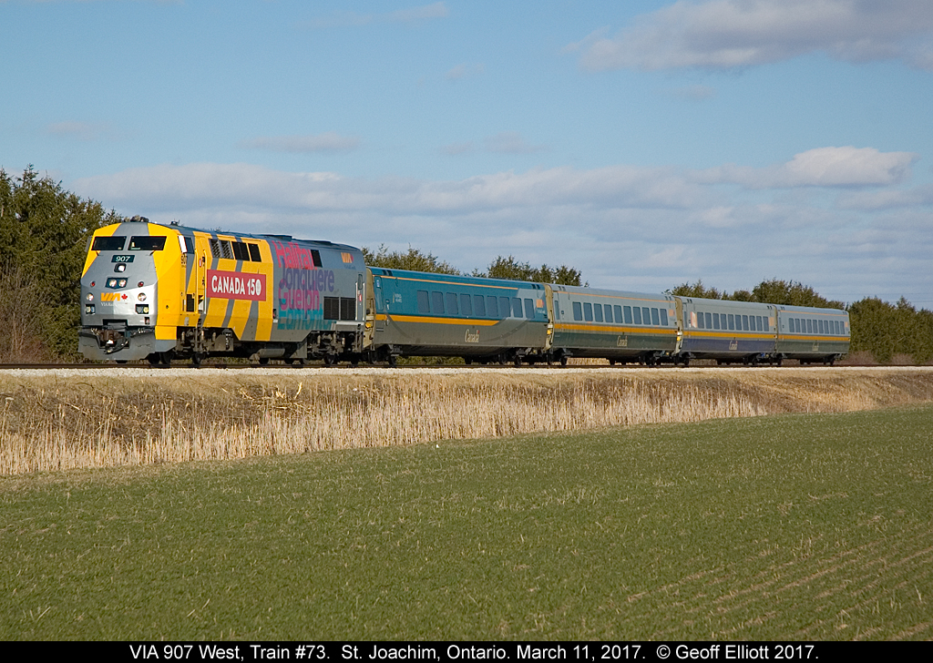 Halifax, Jonquiere, Guelph, and Edmonton adorn the Conductor's side of VIA 907, in it's "Canada 150" livery, as it hustles train #73 and a pure set of LRC cars through St. Joachim, Ontario on March 11, 2017.