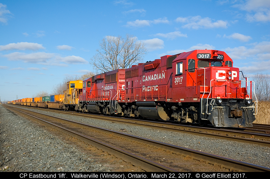 An interesting lift to made later in the day site in Walkerville yard, just outside of Windsor.  The lift is made up of CP GP38AC #3017, GP20C-eco #2259, caboose #422988, and a large cut of loaded well cars.  The caboose has been going back and forth to the U.S. on transfers for a while as a shoving platform but it appears that it must have served it's purpose if it's leaving town.  Not very often do you see a caboose with well cars in this day and age.