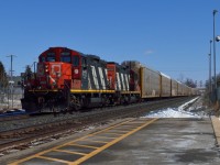 <b>Zebras!</b>  Definitely something I did not expect to see on March break was a pair of 4100 series GP9RM's leading a set of 55 multis.  They slowly crept up from Mac and stopped beside me on the north track to wait for the passage of CN Q14891-16 on the south, before continuing on to Aldershot.  Once there the crew tied down in the yard.<br><br>It's nice to see these old beauts still out on the mainline after 60 years.  Lead unit 4125 having been built in 1955 (62 years) and trailing 4138 built in 1959 (58 years) respectively.