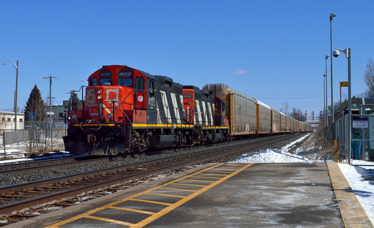 Zebras!  Definitely something I did not expect to see on March break was a pair of 4100 series GP9RM's leading a set of 55 multis.  They slowly crept up from Mac and stopped beside me on the north track to wait for the passage of CN Q14891-16 on the south, before continuing on to Aldershot.  Once there the crew tied down in the yard.It's nice to see these old beauts still out on the mainline after 60 years.  Lead unit 4125 having been built in 1955 (62 years) and trailing 4138 built in 1959 (58 years) respectively.
