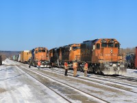 The crews from the Englhart yard job and recently arrived 113 chat about the unique aspects of northern railroading during the winter.  The temperature on this crisp morning felt like -35 degrees Celcius.