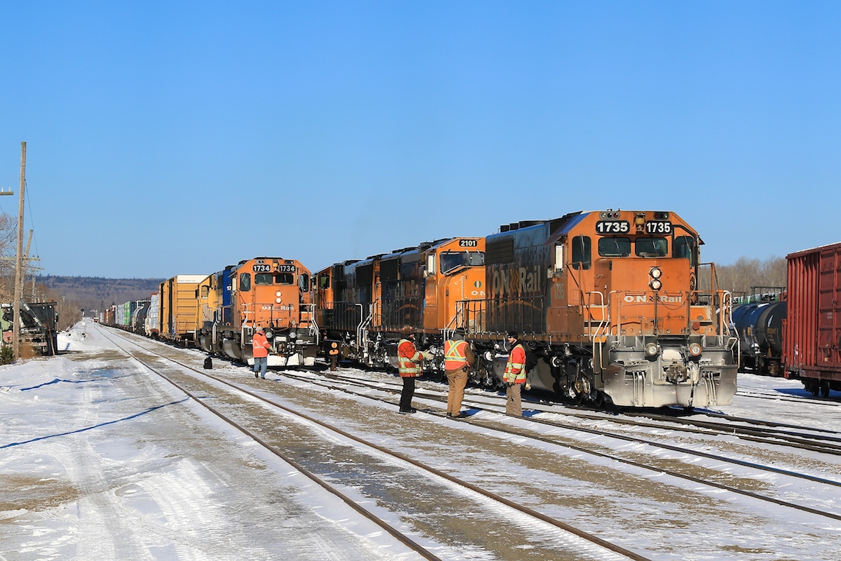 The crews from the Englhart yard job and recently arrived 113 chat about the unique aspects of northern railroading during the winter.  The temperature on this crisp morning felt like -35 degrees Celcius.