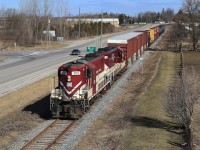 OSR's ex-SOO GP7s are just about to duck under the 401 overpass on their way to St Thomas after completing work in the Ingersoll/Putnam area.  A sunny morning + classic power = another great day of railfanning the OSR.