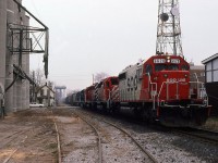 I don't have the dates pinned down but I believe sometime in mid- to late 1985, CPR began operating what was described as "SOO business" via Montreal/Chicago routings and numbered the trains 500-501-502-503 ( at least). Anyway here's eastbound 502 at Center Street in Chatham as he cuts the city in half during his passage. SOO 6620 is leading CP SD-40's 5546 and 5528, which in turn are hauling dead, leased GATX power SD-40 5081 and 5073 still in Missouri Pacific paint. In 1987 CPR leased 10 of these units from GATX Leasing but this was the only time I caught them on film. They were enroute to Toronto or Montreal for placement in service. Trains 501 and 502 were usually daytime passings in the Chatham area, so I did shoot them a few times (between work and family etc). This elevator, whose name I've long since forgotten, is no longer in existence. 
