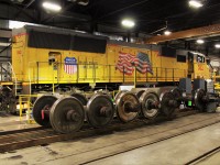 UP SD70M gets a turn on the wheel machine to get it's wheels trued. GE wheel sets are on the rails in front of the 5112.