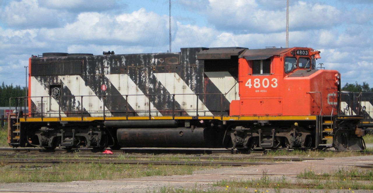 CN 4803 sits on one of the ready tracks during a break from yard work at Gordon Yard in Moncton NB. What a difference from the MLW S13s I remember working the yard when I was a kid.