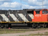 CN 4803 sits on one of the ready tracks during a break from yard work at Gordon Yard in Moncton NB. What a difference from the MLW S13s I remember working the yard when I was a kid.