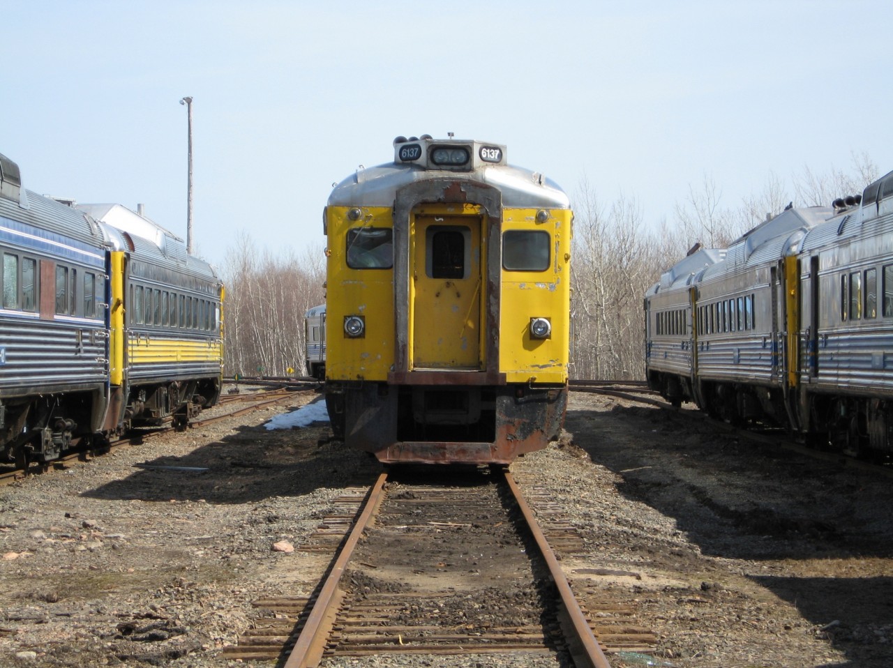One of the fleet of ex VIA RDC's bought by Industrial Railway Services in Moncton rests among friends next to the former CN diesel shop. The original plan was to remanufacture the cars for resale but few received any work. Sadly the company has since folded and all but a handful of the cars have been cut up for scrap.