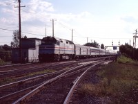 Between 1972 and 1995 (with a suspension between April 1987 and July 1989), Amtrak operated an overnight train between Montreal and Washington . Here we see one of the first runs of the restored southbound "Montrealer", making its suburban St. Lambert stop. Train No. 624 (its number on CN lines) is operating with a then-ubiquitous F40PH and eight cars--what appear to be a baggage car, two sleepers, meal/lounge service, and four Amfleet coaches. The train would be cut back to St-Albans, Vermont and changed to a daytime schedule in April 1995.