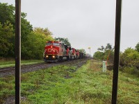 From the wooden platform of the current VIA shelter in Wyoming, 2170 leads this trio of CN engines on this eastbound freight on an otherwise blah Saturday to mark the beginning of October.