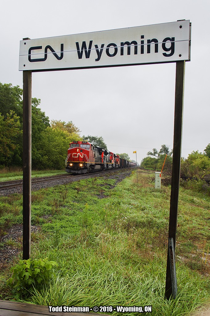 From the wooden platform of the current VIA shelter in Wyoming, 2170 leads this trio of CN engines on this eastbound freight on an otherwise blah Saturday to mark the beginning of October.