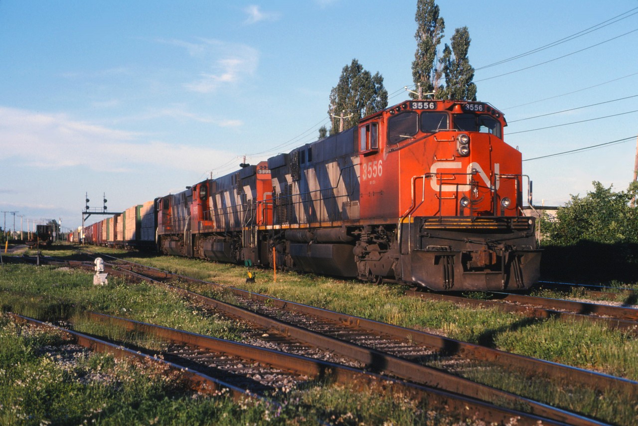 For while in the mid-1990s, CN originated some trains destined for interchange with U.S. railroads at Joffre Yard outside of Quebec City. This included 328 and 335 destined for Conrail at Selkirk and Frontier Yards as well as Chicago train 391. So the three M420W units that we have on today's 391 are a pleasant surprise--at this stage in their careers, they would normally not be found on a train bound for the U.S.! (Most likely these units were was changed out at Toronto.)