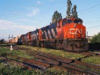 For while in the mid-1990s, CN originated some trains destined for interchange with U.S. railroads at Joffre Yard outside of Quebec City. This included 328 and 335 destined for Conrail at Selkirk and Frontier Yards as well as Chicago train 391. So the three M420W units that we have on today's 391 are a pleasant surprise--at this stage in their careers, they would normally not be found on a train bound for the U.S.! (Most likely these units were was changed out at Toronto.)