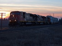 As the sun sets, CN 148 rounds the curve at Lovekin as they get into the climb towards Newtonville. There is no sign of the train slowing as it passes, so CN 5632, IC 1017, and CN 5783 must all be performing adequately today. 1919hrs.