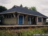 The former CN Casselman station, as seen in 2003. It wasn't in the greatest of shape, but avoided the fate of being demolished like so many other stations in the Ottawa area such as Glen Robertson, Maxville, Hawkesbury, etc. Maintenance crews were still using the station at the time of this photo, and VIA trains still stopped although they used a small shelter located just a few feet away. However, I have seen other photo's of the station posted online since my only visit in 2003. It appears it has been given a fresh two tone painting, and VIA's shelter has been removed as they now occupy the station once again.