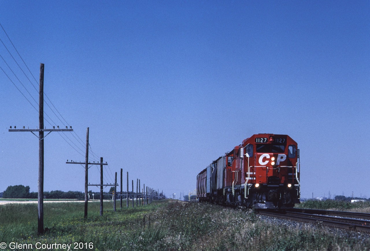 CPR 1127 started life as a GP35 but CPR converted it to a non-powered Control Cab. Here it's working a local freight eastward towards Winnipeg.