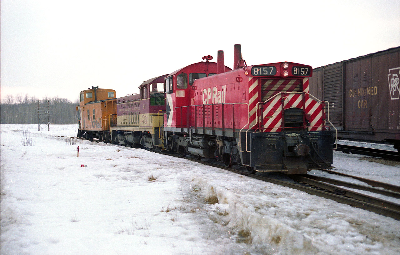 In keeping with the current theme of things, here is another SW1200RS image. CP 8157, along with TH&B 51 (NW2u) and caboose has just made the trek up from Hamilton. This image is of it on the curve where the line meets the Galt Sub. Back then the line was referred to the Goderich Sub. Since the line thru to Goderich was taken up, the track as been referred to as the Hamilton sub. CP 8157 became CP 1243 in 1982, then dealt off to Louis Dreyfus Corp, a world wide company, as their 2003 in 1998. No idea where that unit is now.