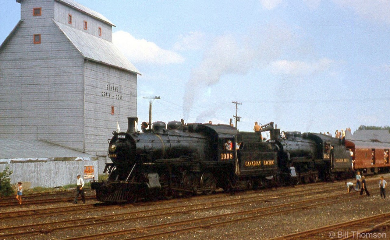 CPR 1098 and 1092 handle the NRHA Buffalo Chapter excursion over CP, pictured with children and attendees in Orangeville Yard by the grain elevator, just north of Townline Road and the station site (visible above the baggage)

The train northbound at Cataract: http://www.railpictures.ca/?attachment_id=28108