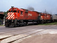 
In late August 1980, I had just been classed as Locomotive Engineer. I had all of 1 week's seniority and I was forced on a midnight yard job in Sarnia. It wasn't bad, at least I had weekends off. I was out driving around after having slept until 2pm, when I heard a CPR horn on the far side of town. I waited at the Wellington Street crossing and caught this westbound with 4723-4562 just a-boppin' along with no work to do. I never noticed those trailers until now, they look a little unusual with an unfamiliar logo. Must have been for the Windsor pig ramp, anyone know what they could be ?