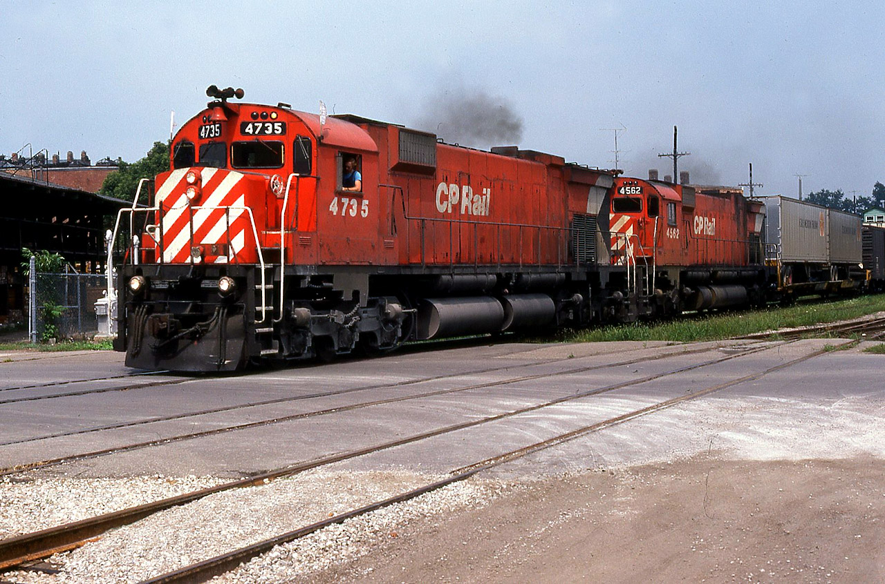 In late August 1980, I had just been classed as Locomotive Engineer. I had all of 1 week's seniority and I was forced on a midnight yard job in Sarnia. It wasn't bad, at least I had weekends off. I was out driving around after having slept until 2pm, when I heard a CPR horn on the far side of town. I waited at the Wellington Street crossing and caught this westbound with 4723-4562 just a-boppin' along with no work to do. I never noticed those trailers until now, they look a little unusual with an unfamiliar logo. Must have been for the Windsor pig ramp, anyone know what they could be ?