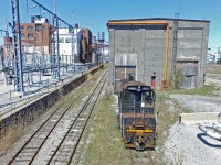 With the news the Thorold South paper mill had been shut down, at least for the time being while Resolute Forest Products looks for a new owner, it seemed appropriate to dig out a few photos of the plant. This one I neglected to upload originally simply because of fairly obvious reasons. This is a drone photo in case anyone thinks I hopped a barbed wire fence with a ladder.
<br><br>
In this photo, a few portions of the plant are visible that otherwise can't be seen without obstruction due to a tall barbed wire fence along Niagara Falls Road. Directly behind the unit is the old engine shop. Believe it or not, there was a time this plant was so busy that a dedicated engine shop was built to service the switchers that worked there. I believe the shop closed sometime in the 1980s. Most of the buildings in this photo date back to the very early 1900s, and has changed owners many many times, however, the most notable has probably been Abitibi. As for this SW1200RS, 1324 evidently has CN heritage, and traces of original green can be seen on the roof, which most likely would be factory original paint from when it rolled out of GMDD London in September 1958. Unfortunately this unit suffered a prime mover failure sometime early in the winter of 2014, in which CN temporarily serviced the plant themselves, and then 1305 came in as the replacement. Judging the rust on the rails in front of the unit, it had probably sat in this location since then. However, just a month after this photo was taken, 1324 was moved into the former engine shop, most likely to deter vandals. Its fate is unknown, though if the frame is in decent enough shape, a prime mover swap may be possible since switchers are in high demand. Who knows though, it is also possible some crucial parts have already been removed off the unit for 1305 making that not feasible.
<br><br>
What will happen to all the equipment and infrastructure here is unknown since the plant is no longer in operation. Apparently Resolute Forest Products is in talks with another company to supposedly convert the plant to produce brown paper, for fast food and leaf bags mostly. Perhaps not all hope is lost in this case, however, the cost to produce in Ontario is very high particularly due to hydro rates and for sure will factor as a deterrent. Time will tell. 
<br><br>
As for the story behind this photo, it was a mere one week earlier I was flying my drone over the interlocking at Port Robinson West to get a picture of CN 421, which had a DPU for possibly the first time ever. After landing my drone however, I heard another horn than sounded oddly similar to a vintage M3H horn, and I knew it had to be the paper mill switcher. I managed to see it, and followed it back to the plant, which is when I noticed 1324 was also sitting there. Unfortunately, I was never was able to get a shot of 1305 and 1324 side by side. Nonetheless, over the next few months I got several pictures around the plant, including this shot of 1324 one week after I first got photos of the operation. I'm glad I got photos when I did, because if future plans for this plant don't work out, the switchers will likely be quietly moved out without any chance to photograph them here again.
