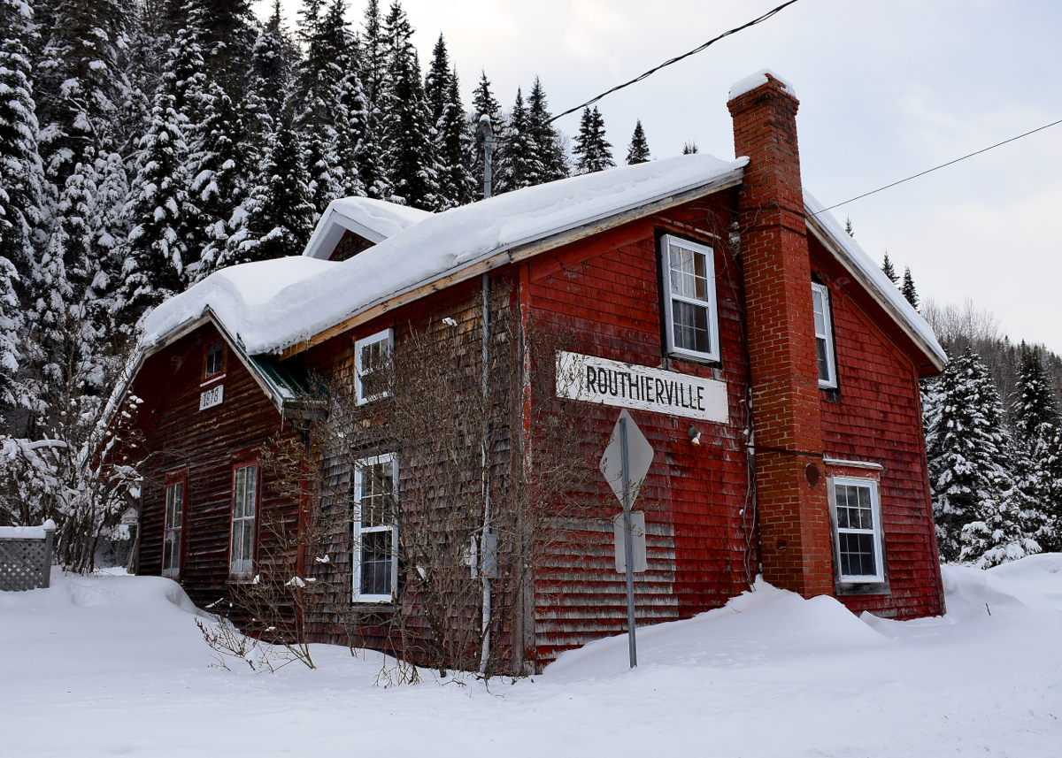 On the way back from shooting the Windmill train in the Gaspe, we stopped in Routhierville, Qc to hopefully shoot CN 562, which was coming from Mont-Joli light power to Matapedia to pick up the windmill train. After a 5 minute wait, we gave up as it was quite cold and we figured it had already passed. It turns out the train had struck a skidooer a bit further north, in the town of Causapscal.

At least I was able to shoot this out of use train station; if the info I found online is correct, it was built in 1878 for the Intercolonial Railway. The track out back is CN's Mont Joli Sub, used only by VIA 14/15 (overnight) and local traffic between Mont-Joli, Qc and Campbellton, NB.