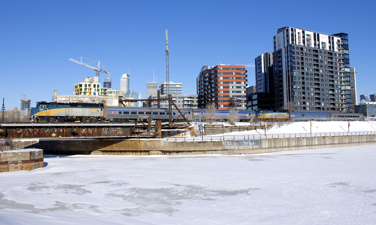 VIA 605/607 for northern Quebec is passing Wellington Tower in Montreal. At Hervey Jct this train will split, with the lead F40 and two cars going to Jonquière and the other half going to Senneterre.
