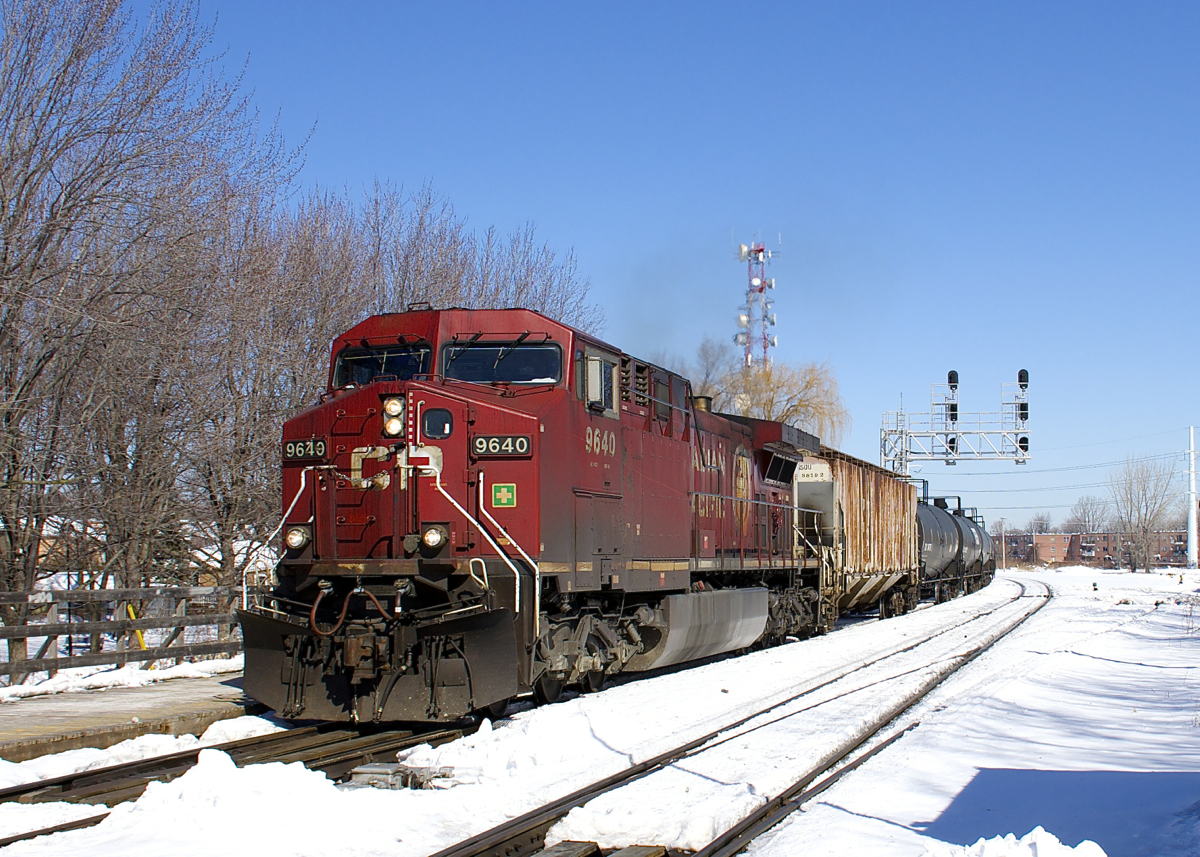CP 650 is passing through Lasalle Station just before noon on a gorgeous winter day. Power is CP 9640 up front and CEFX 1058 on the tail end.