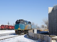 VIA 67 with VIA 6426 leading is about to stop at Dorval Station. At left is CP 119 (with CP 9350, CP 2278 & CP 8844), which will also be heading west shortly. At right is a new overpass which will soon go over the CN and CP tracks here.