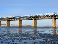 It's officially spring, but there's still a bit ice on the St. Lawrence River and it's -10 as AMT 76 makes its way towards the island of Montreal during the morning rush hour.