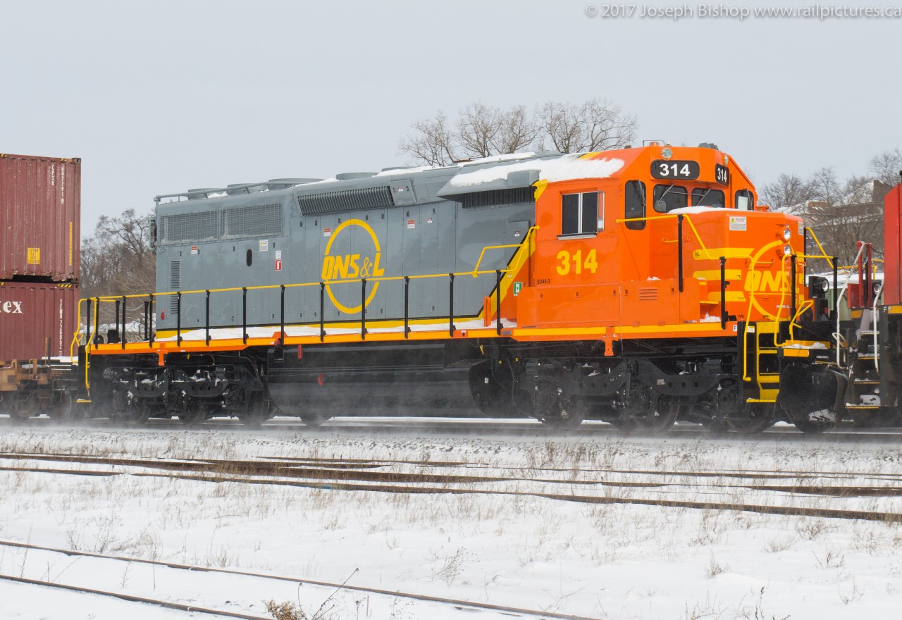 Freshly rebuilt QNSL 314 trails third out on CN 148 through Brantford Ontario.