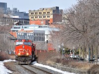 A late CN 149 is rounding a curve as it leaves the port of Montreal with CN 2556 & CN 8917 leading 9,602 feet of containers. 