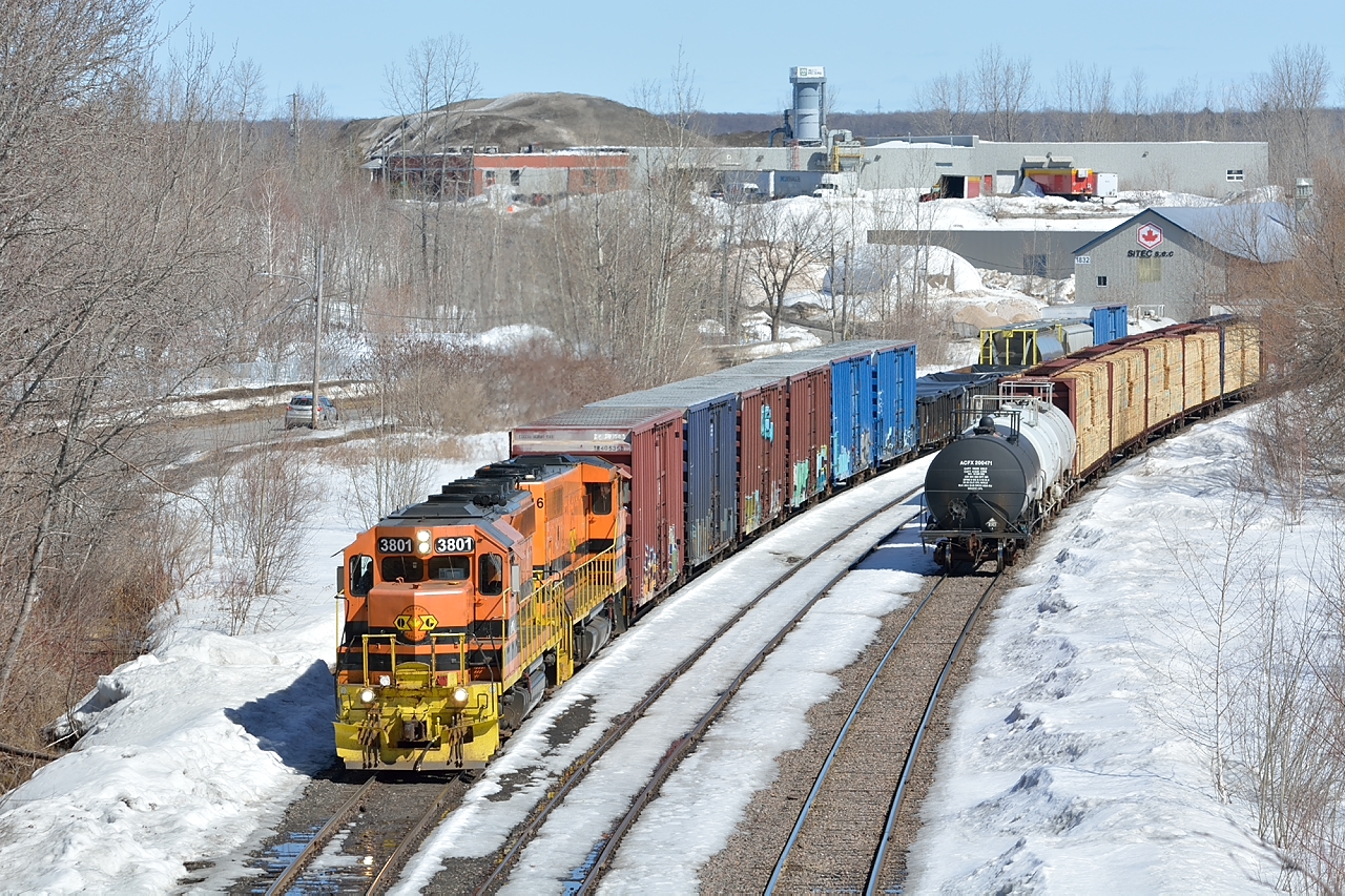 Quebec Gatineau's Trois Rivieres-Shawinigian turn doubles its train together in the former Shawinigan Falls Terminal Railway yard before departing south.