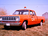 Before hi-rail vehicles were common place at CN, Engineering field supervisors in most departments were assigned a car or truck to perform their duties. This 1976 Dodge D-100 Club Cab Custom was the daily driver for the Roadmaster (my Dad) in Jarvis, ON. The club cab was a Dodge innovation in 1973 and made it the work truck of choice for a number of years with all that 'extra space'. There were no creature comforts in these company assigned vehicles. Bench seat, manual windows, no A/C, no cruise control, and no cab insulation. A bare bones work truck. I added the roof top revolving light that I brough over from the Work Equipment shop at Danforth (Scarborough, ON) and remember the mounting bolts protruding right into the cabin because there was no headliner!