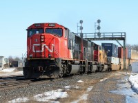 CN SD75I 5666 leads train Q149 under the signal bridge at Paris, Ontario with Union Pacific C41-8W 9421 trailing. 
