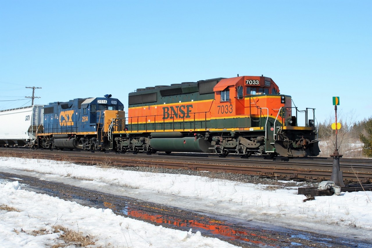 CN train M394 is seen waiting on a fresh crew at Paris, Ontario with a solid FPON consist; BNSF SD40-2 7033 and CSX GP38-2 2514.