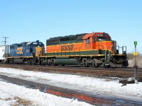 CN train M394 is seen waiting on a fresh crew at Paris, Ontario with a solid FPON consist; BNSF SD40-2 7033 and CSX GP38-2 2514.