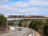 CN 2593 leads CN 8901, CN 5786,CN 8960 across the rail bridge that crosses highway #4 in Folly Mountain heading west towards Amherst 