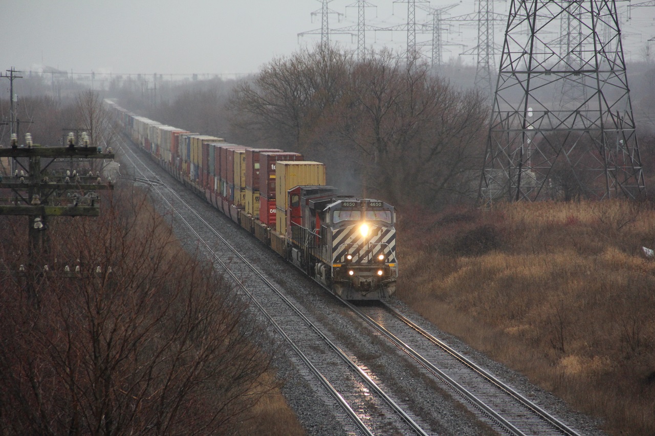 Train 106 is approaching the Waverly road overpass  Bowmanville. in a rain, snow mix with strong east winds. The aging BC Rail unit is suffering electrical issues causing the train to move along at 25 mph. As long as 106 is moving its fine according to the dispatcher. Problem being there on the block of another east bound having power problems as well. that train had left Oshawa 45 minutes prior to 106 catching it.